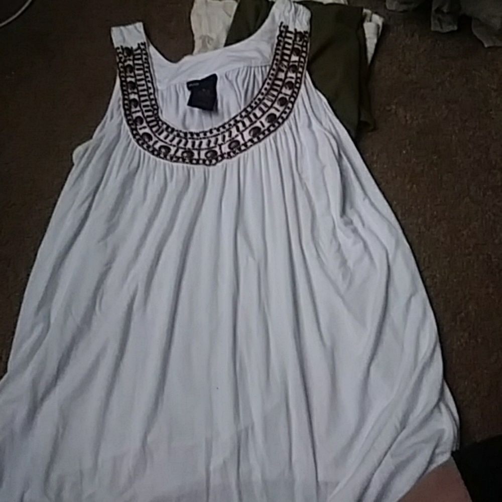 White shirt with brown beads